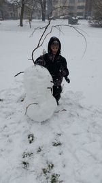 Full length of child on snow covered land