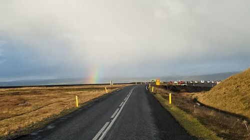 Road amidst landscape against sky