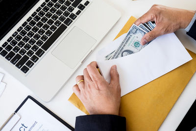 High angle view of man using laptop