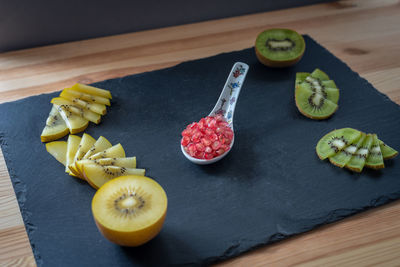 High angle view of chopped fruits on cutting board