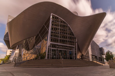 Low angle view of modern building against sky
