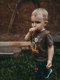 Cute boy standing outdoors