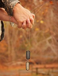 Couple holding dog tags