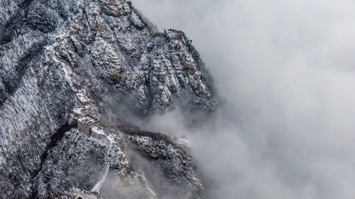 Extreme close-up of rock formation against sky