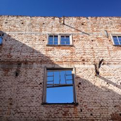 Low angle view of building against blue sky