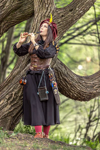 Woman standing in forest