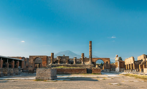 Old buildings against blue sky