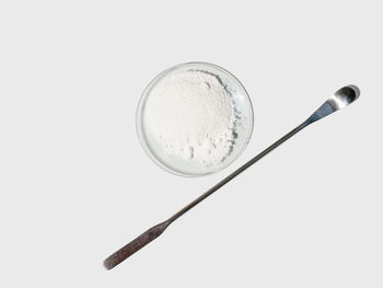 High angle view of objects on table against white background
