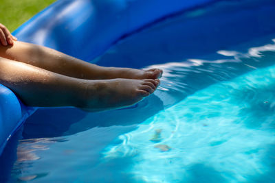 Low section of person in swimming pool