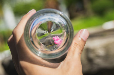 Close-up of hand holding glass