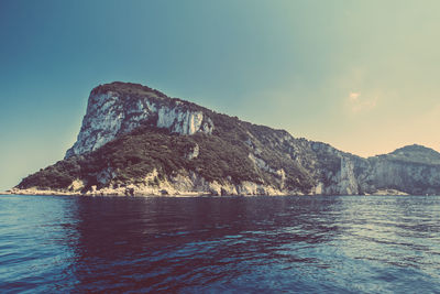 Scenic view of sea with mountains in background