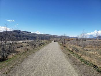 Road amidst landscape against sky