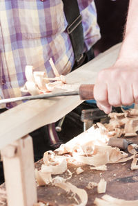 Midsection of man preparing food on table