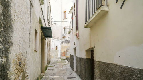 Narrow alley along buildings