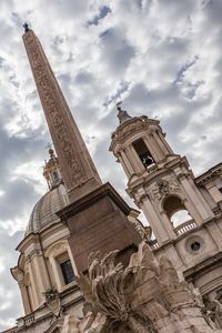 Low angle view of statue against cloudy sky