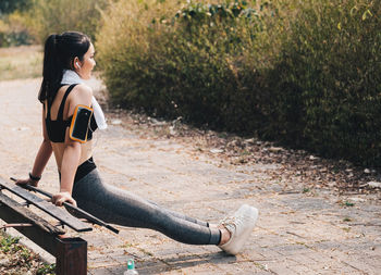 Woman sitting on field