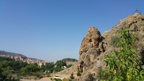 Scenic view of rocky mountains against clear blue sky