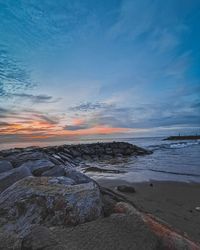 Scenic view of sea against sky during sunset