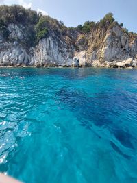 Scenic view of sea against blue sky