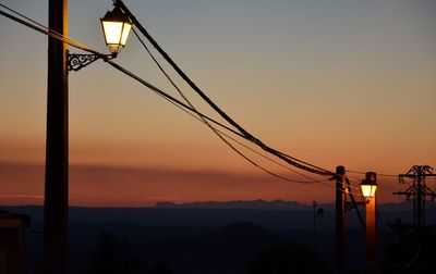 Silhouette mountain against sky during sunset