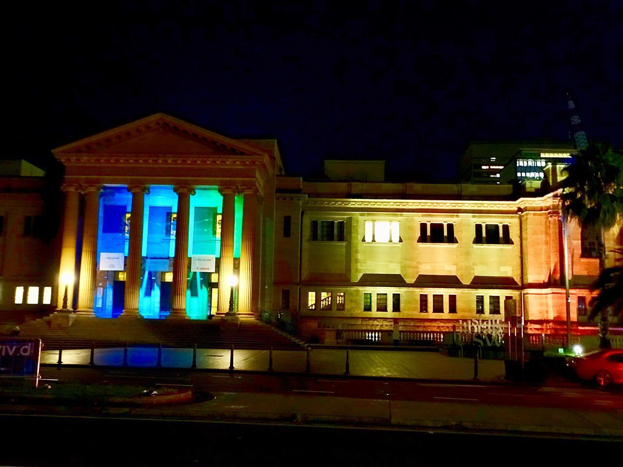 ILLUMINATED BUILDING AGAINST SKY AT NIGHT