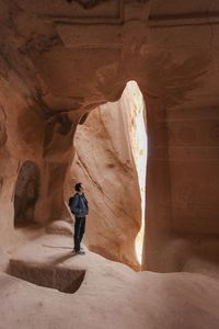 Full length of man standing on rock