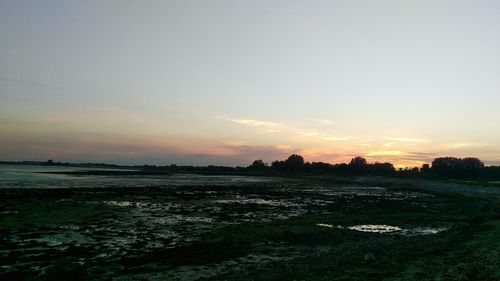 Scenic view of sea at sunset