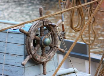 Close-up of rope tied on wood