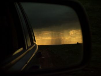 Car on road at sunset