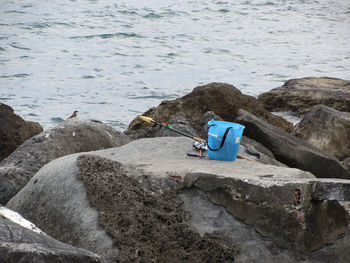 Fishing gear on the rock by the sea