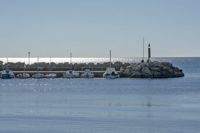 Scenic view of sea against clear sky during winter