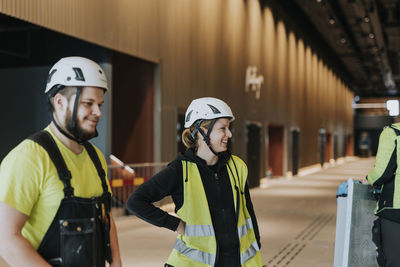 People talking at construction site