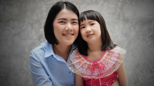 Portrait of happy mother and daughter