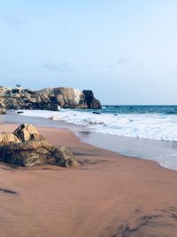 Scenic view of beach against sky