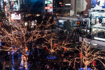 Illuminated city street at night