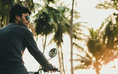 Low angle view of man sitting on motorcycle