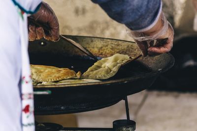 Midsection of man preparing food