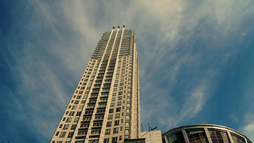 Low angle view of skyscraper against sky