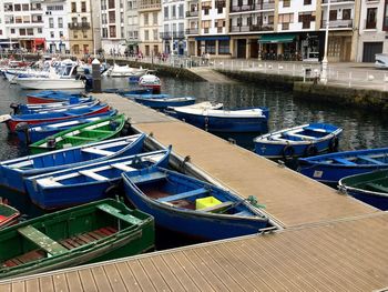 Boats in canal along buildings