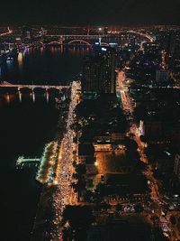 High angle view of illuminated cityscape at night