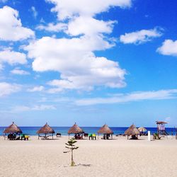 Panoramic view of beach against blue sky