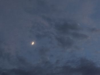 Low angle view of moon against sky at night