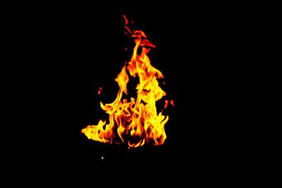 Close-up of bonfire against black background