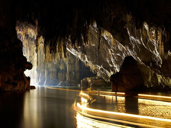 Panoramic view of sea seen through cave