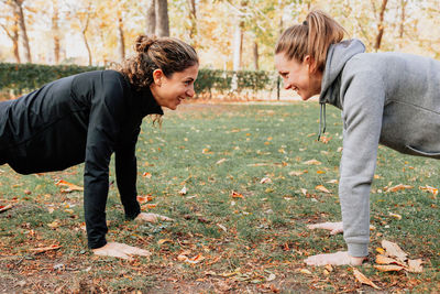 Mid adult women exercising at park