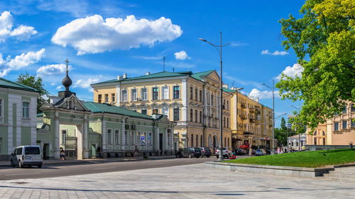 Street amidst buildings in city against sky