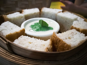 Steam thai sangkaya or pandan kaya bread with sweet dipping sauce.