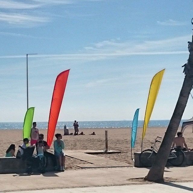 sea, beach, horizon over water, water, leisure activity, sky, vacations, person, large group of people, shore, lifestyles, men, sand, mixed age range, beach umbrella, tourism, scenics, beauty in nature, relaxation