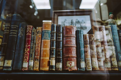 Vintage books with shabby covers on bookshelf