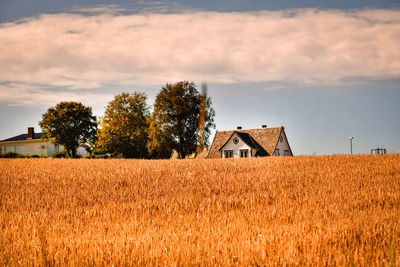 House on field against sky